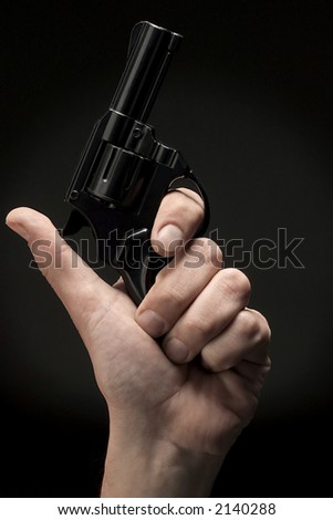 hand holding black revolver