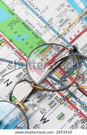 pair of rimmed glasses over NYC subway map