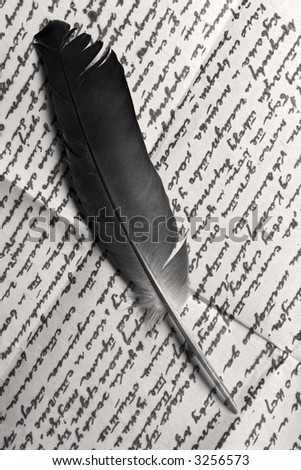 quill over old letter - black and white