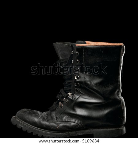 black army worn-out boot on black