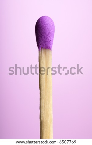 closeup of a purple match against pink background