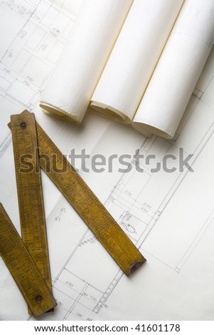 architecture plans and a carpenter\'s meter