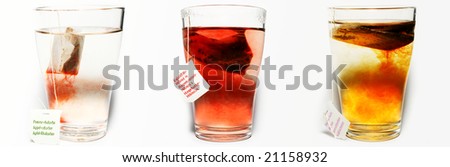Three cups of fruit tea hibiscus, apples and forest fruits. Labels are in dutch, french and german