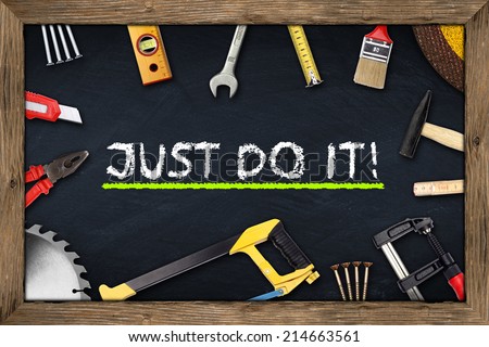 tools on just do it blackboard with wooden frame