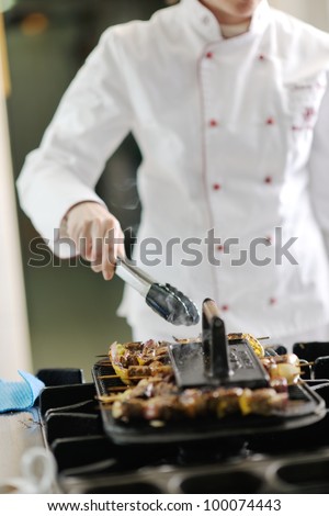 beautiful young chef woman prepare and decorating tasty food in kitchen