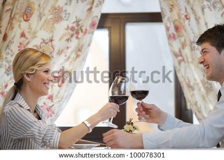 A young couple having romantic  dinner at a restaurant