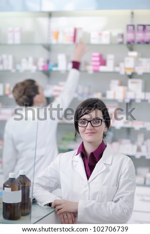 team of  pharmacist chemist woman group  standing in pharmacy drugstore