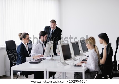 business people group with  headphones giving support in  help desk office to customers, manager giving training and education instructions