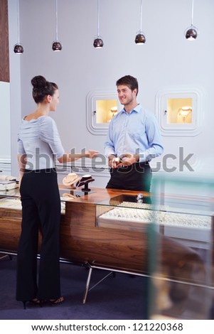 business man selling in jewelry store