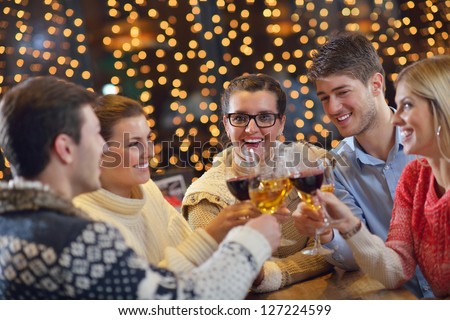 romantic evening date in restaurant  happy young couple with wine glass tea and cake