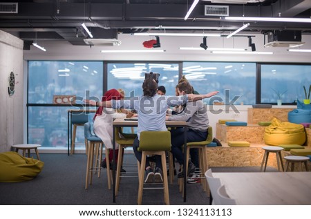 Multiethnic Business team using virtual reality headset in office meeting  Developers meeting with virtual reality simulator around table in creative office.