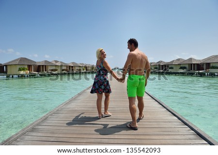happy young  couple at summer vacation have fun and relax at beautiful sunny  day