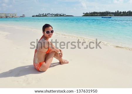 beautifu and happy woman girl on beach have fun and relax on summer vacation  over the sea