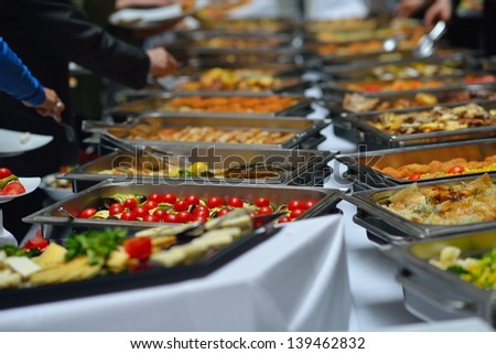 people group catering buffet food indoor in luxury restaurant with meat colorful fruits  and vegetables