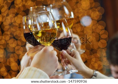 Celebration. Hands Holding The Glasses Of Champagne And Wine Making A Toast.