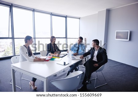 Group Of Happy Young Business People In A Meeting At Office