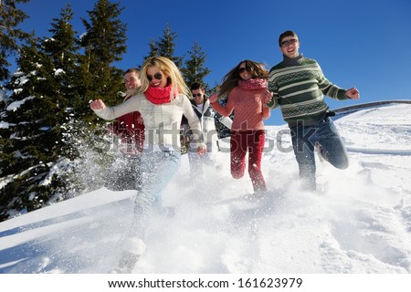 happy friends have fun at winter on fresh snow healthy young people group outdoor happy friends have fun at winter on fresh snow healthy young people group outdoor