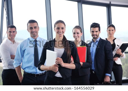 Group Of Happy Young Business People In A Meeting At Office