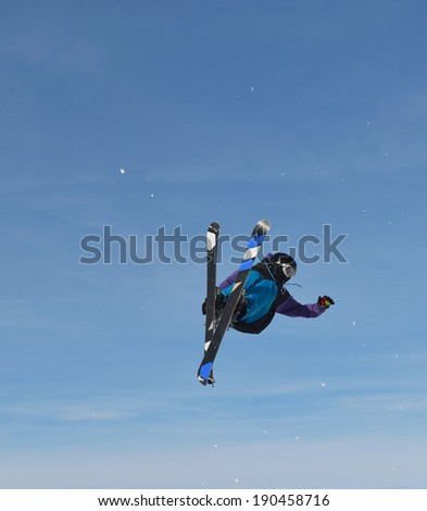jumping skier at mountain winter snow fresh suny day