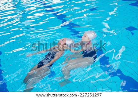 help and rescue action in swimming school at pool