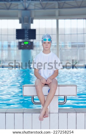 health and fitness lifestyle concept with young athlete swimmer recreating  on indoor olympic pool