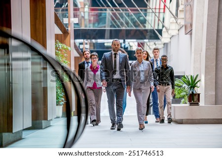 young multiethnic business people group walking standing and top view
