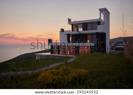 External view of a contemporary house modern villa at  sunset