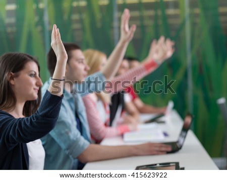 senior teacher teaching lessons, smart students group raise hands up in school  classroom on class