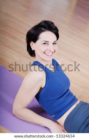 happy woman in fitness studio