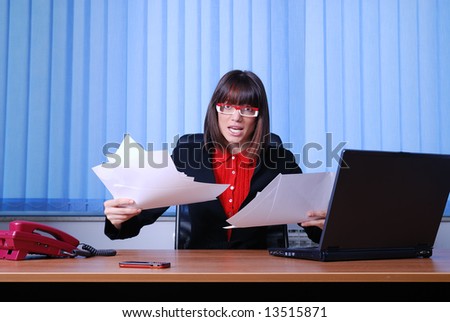 .angry businesswoman holding empty documents