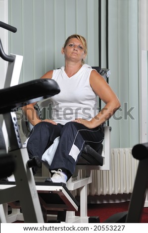 Mature healthy woman work out in fitness
