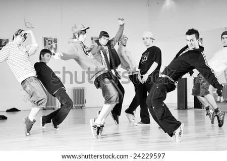 group of young happy boys dance  together in dence studio
