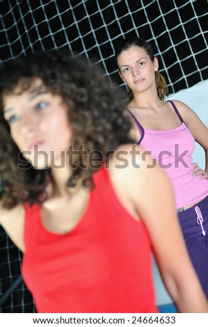 two women work out and streaching  in fitness club