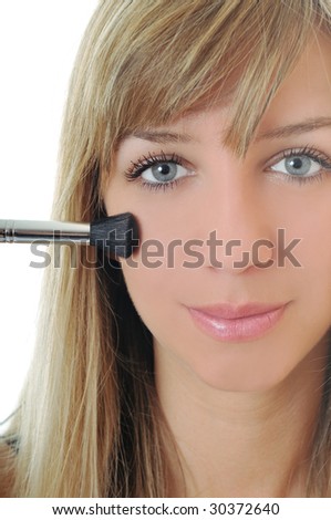 beautiful young woman apply powder 