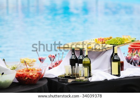 vine salad cheese and other food on buffet party outdoor