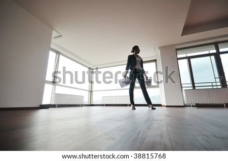 young business woman throw papers and documents from joy in air representing concept of freedom joy and stress control