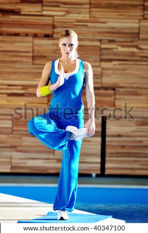 one young healthy woman exercise fitness recreation and yoga indoor