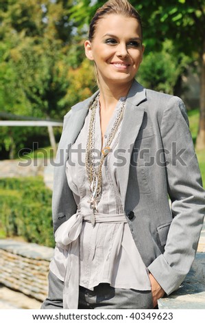 young woman posing in fashion  business and casual clothing outdoor