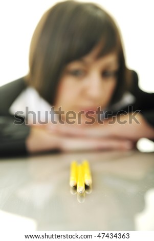 young business woman choosing right yellow pencil and representing concept of perfection and order