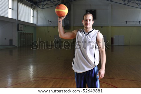one healthy young  man play basketball game in school gym indoor relax