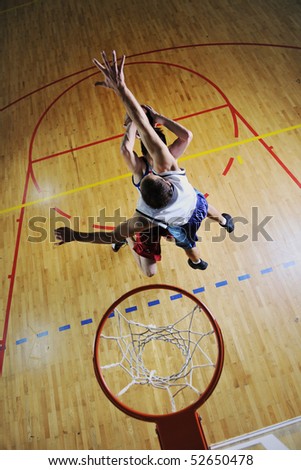 competition cencept with people who playing and exercise  basketball sport  in school gym
