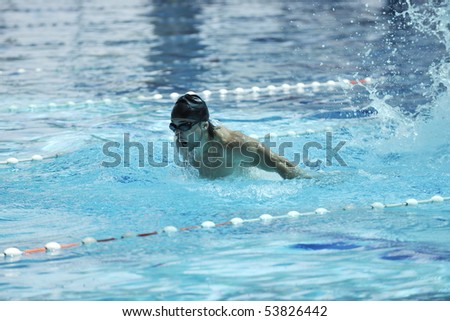 young healthy man with muscular body in swimming pool and representing healthy and recreation concept