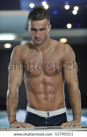 stock-photo-young-healthy-good-looking-macho-man-model-athlete-at-hotel-indoor-pool-55790311.jpg