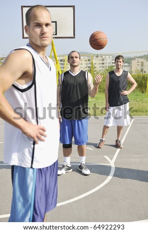 basketball player team group  posing on streetbal court at the city on early morning