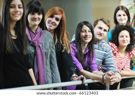 happy students people group portrait at university  indoor building