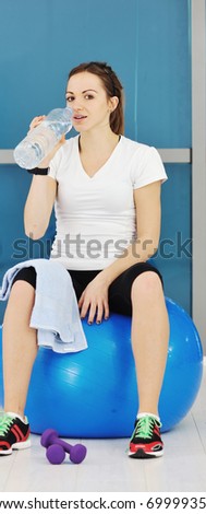 young woman drink water at fitness workout training at sport club