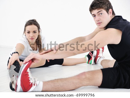 happy young couple fitness workout and fun at sport gym club