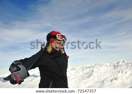 happy young woman have fan while relaxing at snow with ski and snowboard sport at winter seasonyoung athlete man have fun during skiing sport on hi mountain slopes at winter seasson and sunny day