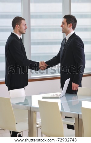 two young businessman handshake on business meeting at modern office and representing success