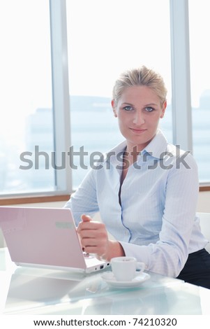 one happy young business woman working on laptop computer at  group team meeting at modern office
